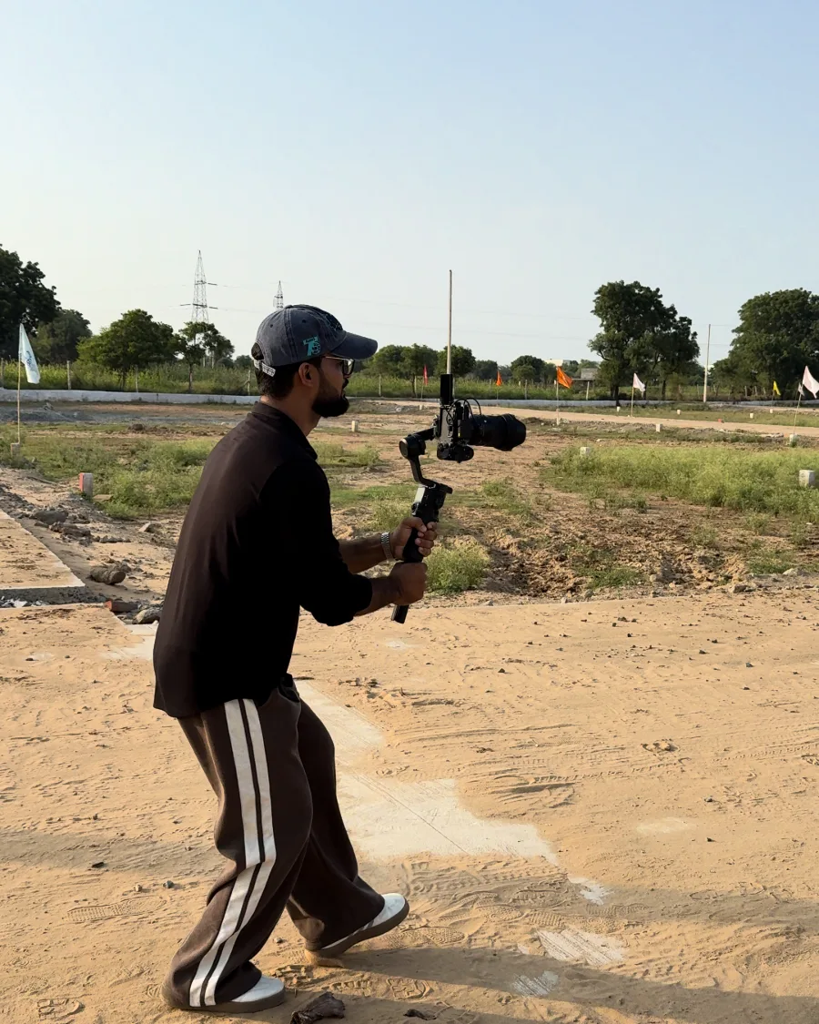 An AZIORX videographer filming on location with a gimbal